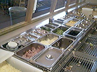 The topping bins full of fresh ingredients